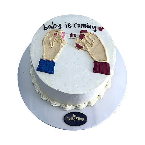 A pregnancy test-themed cake