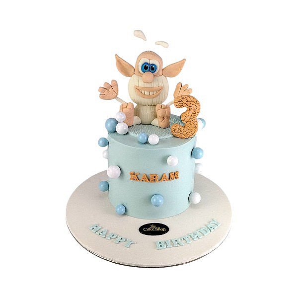 A cake in the shape of a doll